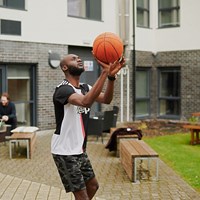 Student plays basketball