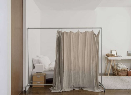 room divider close to a bed