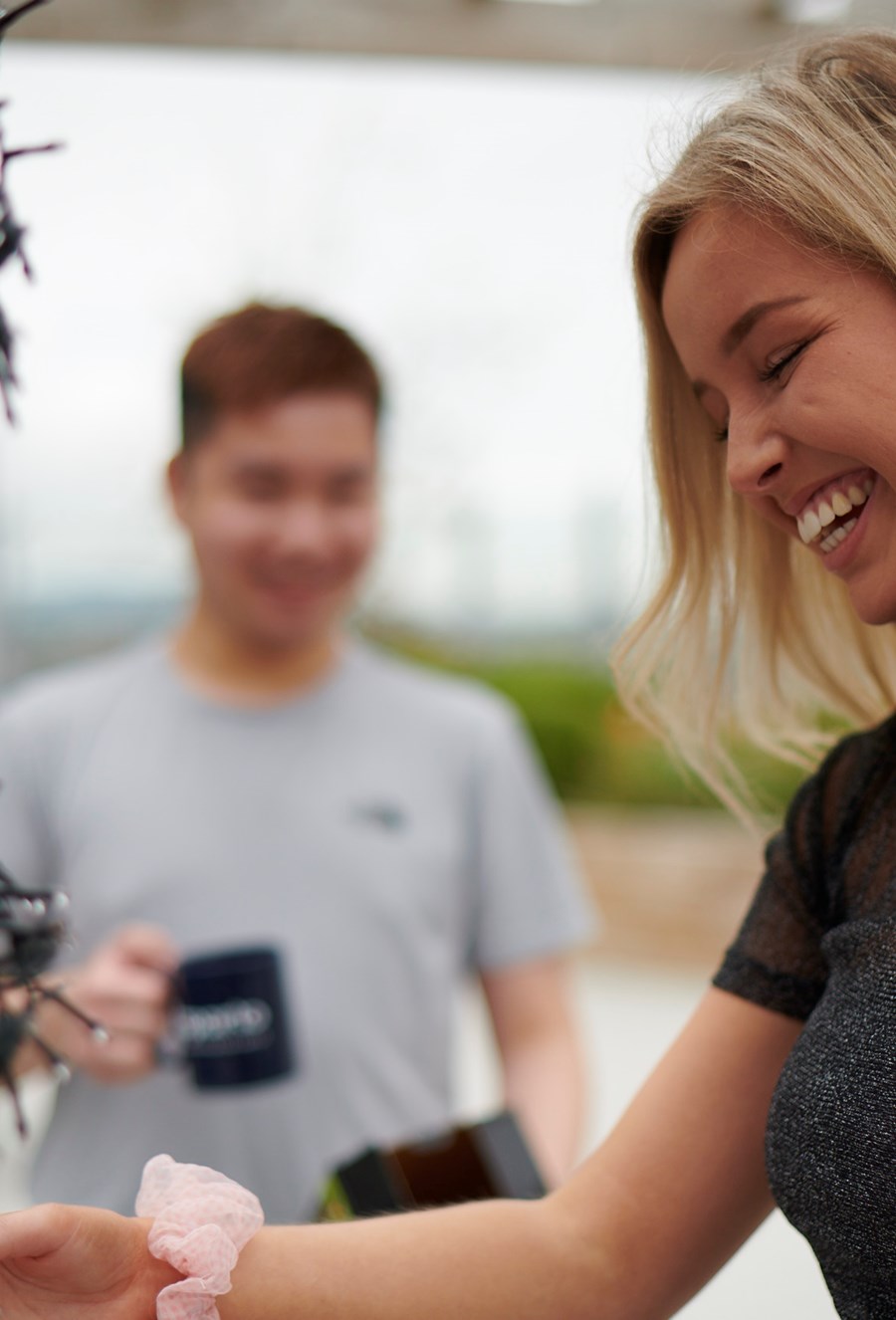 student laughing on the rooftop of aparto beckett house
