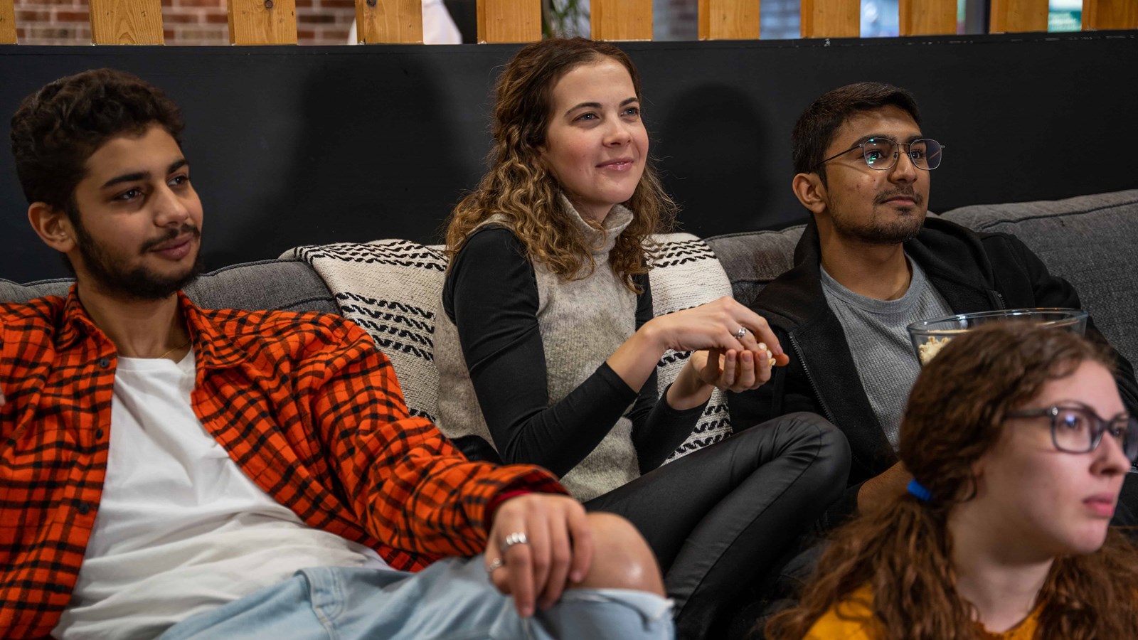 students watching a movie at the aparto stoneworks lounge