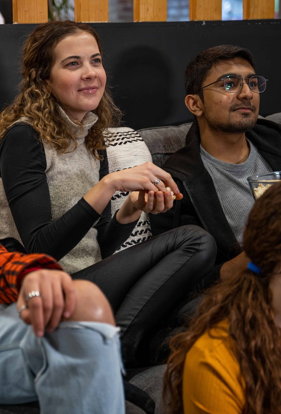 students watching a movie at the aparto stoneworks lounge