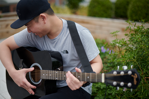 Student playing the guitar