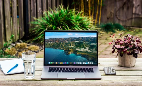 Laptop on a desk outside