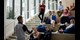 Students sitting on steps in reception in Lancaster student accommodation