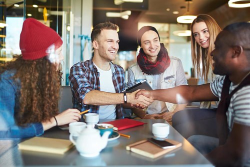 A group of students volunteering at a coffee place