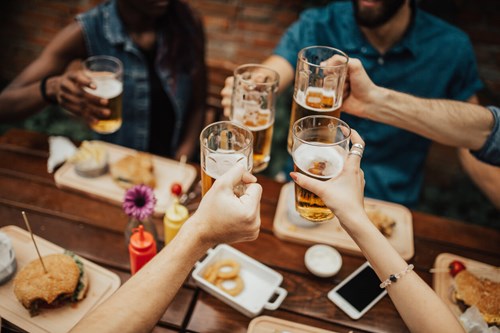 students drinking a beer