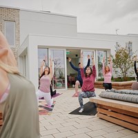 The Loom yoga class on rooftop terrace in Dublin student accommodation