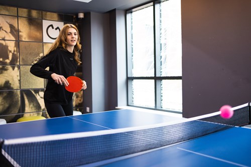 A student playing ping pong