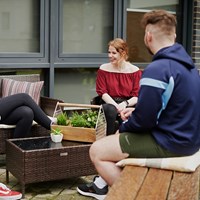Students converse outdoors