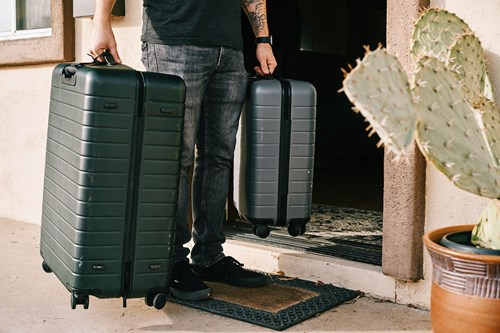 student with luggage