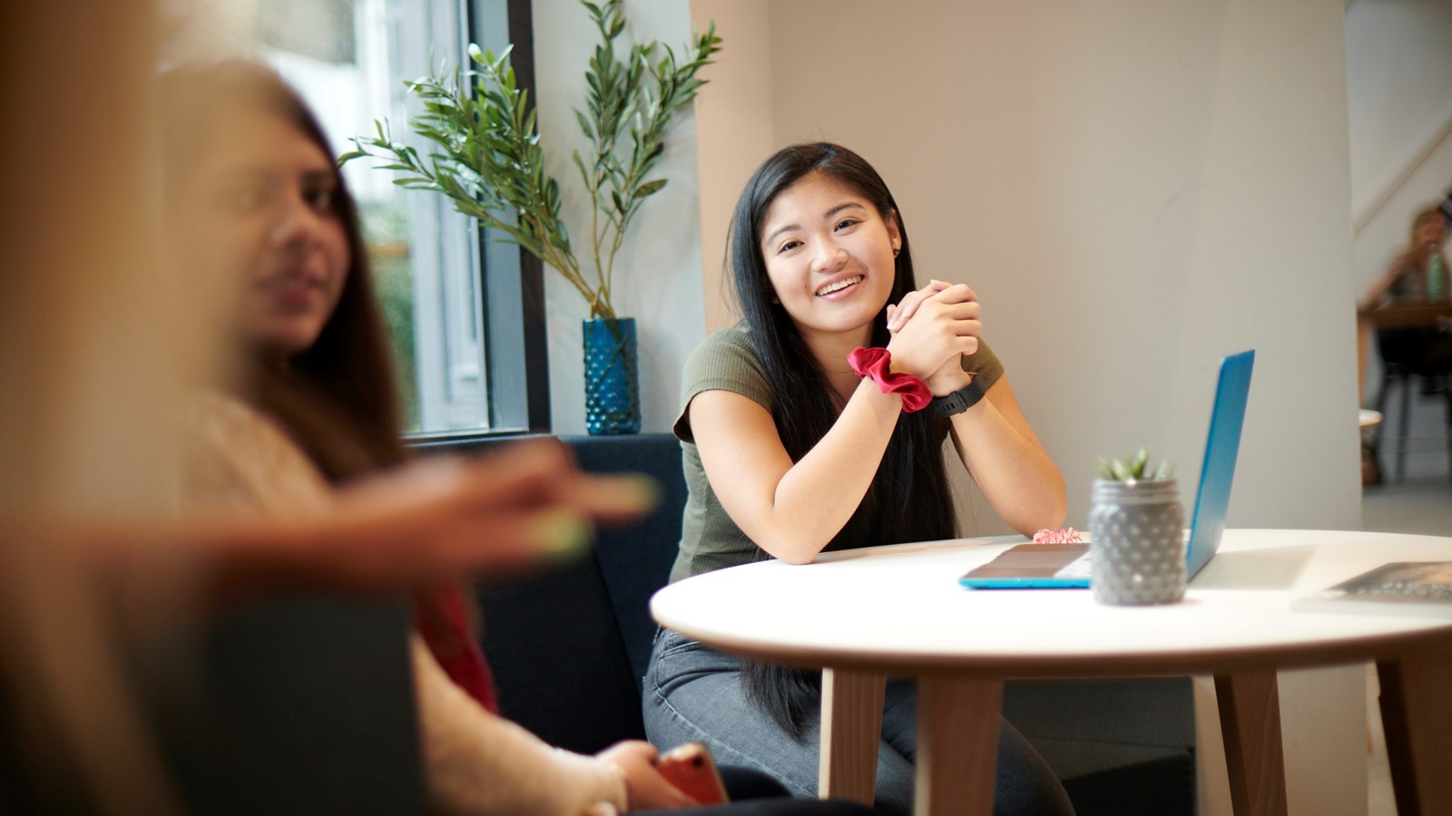 students conversing in beckett house common room