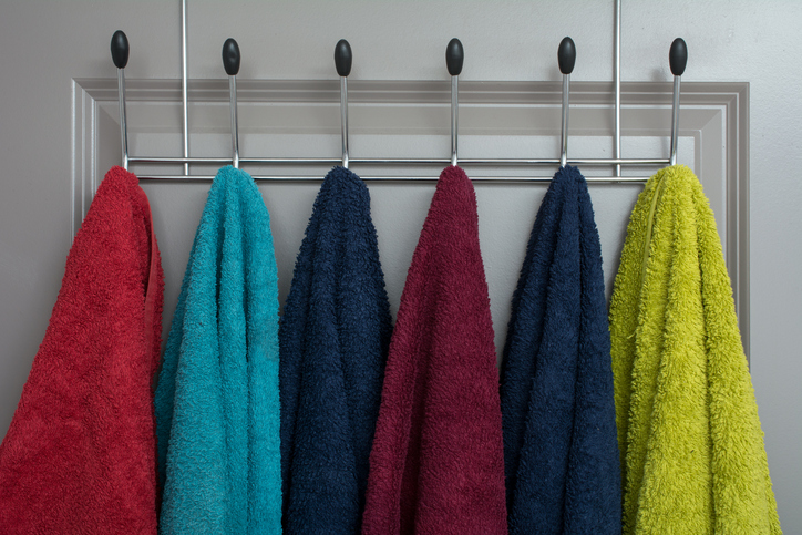 towels on a clothes rack inside bedroom 